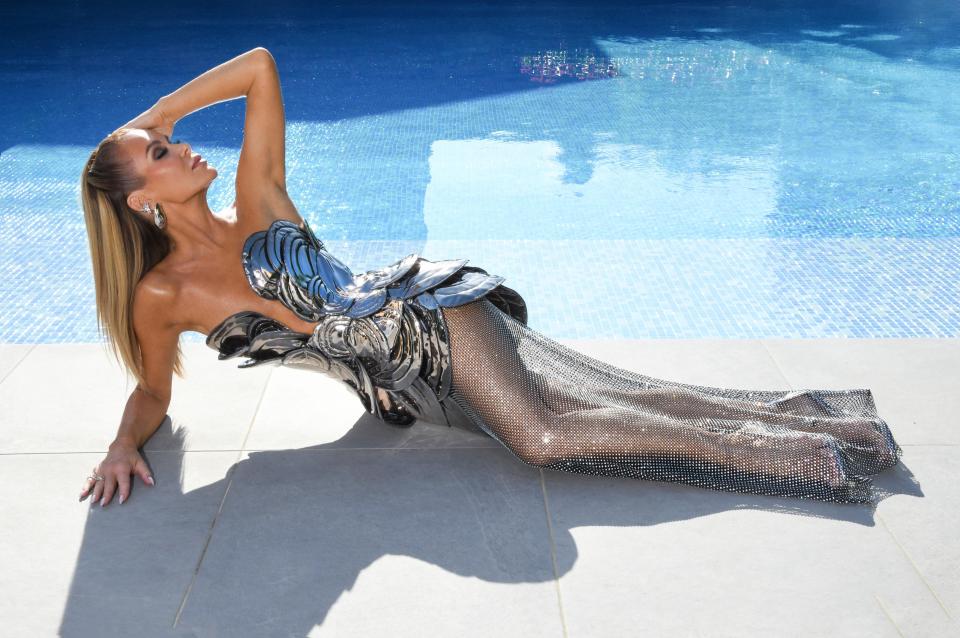 The star shared with The Sun this snap of her lounging by the pool in the same outfit