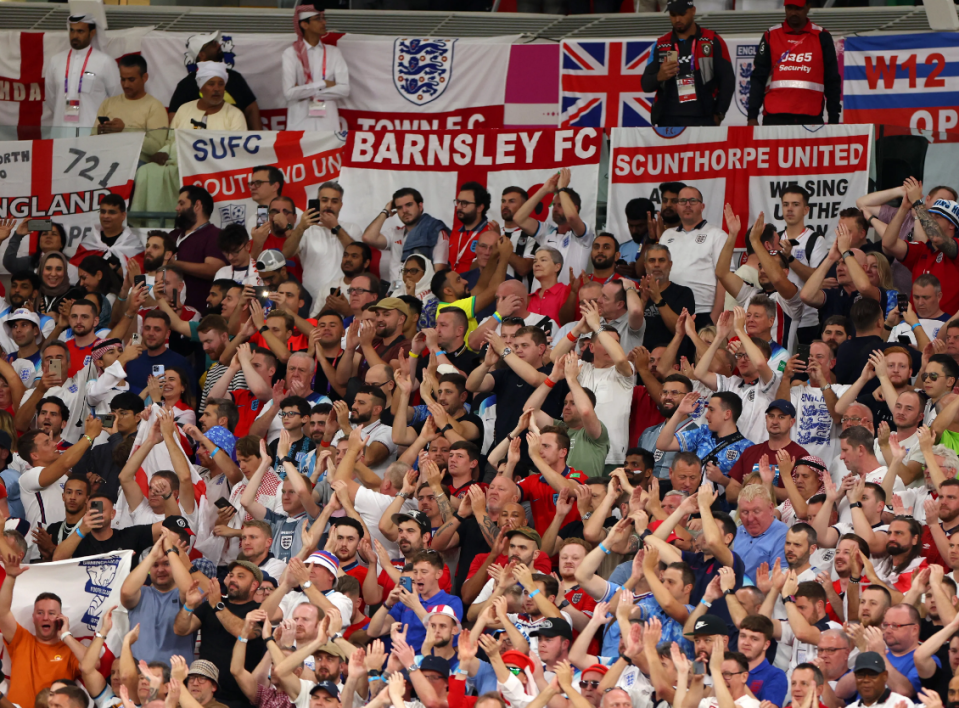 Fans cheering for their home teams during a football match