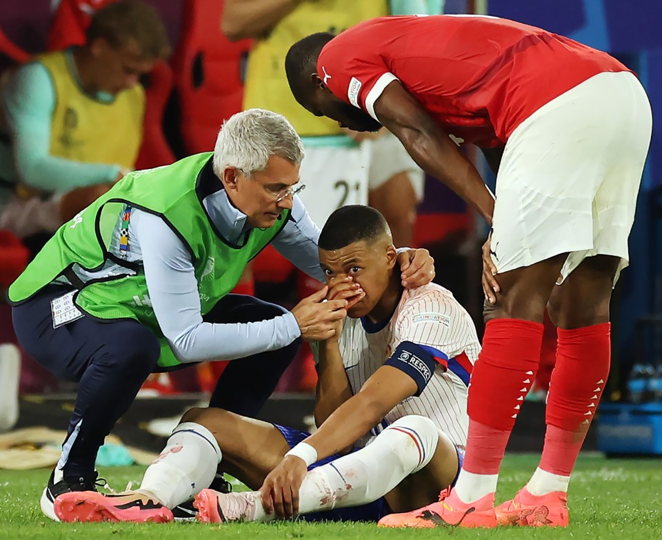 The French captain was covered in blood after breaking his nose against Austria