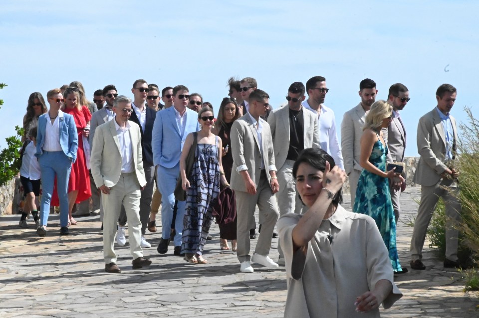 The wedding party were seen walking up to the venue