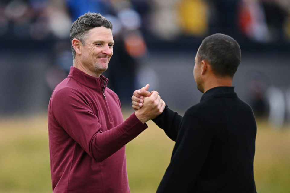 TROON, SCOTLAND - JULY 21: Justin Rose of England and Xander Schauffele of the United States shake hands on the 18th green following their round on day four of The 152nd Open championship at Royal Troon on July 21, 2024 in Troon, Scotland. (Photo by Stuart Franklin/R&A/R&A via Getty Images)