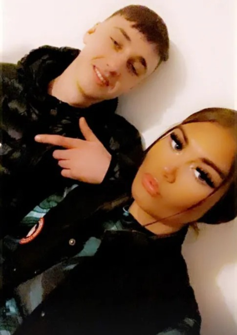 a man and a woman are posing for a picture together