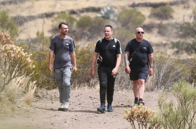 Jay's brother (L) and dad (R) with a volunteer searching in the Spanish hills