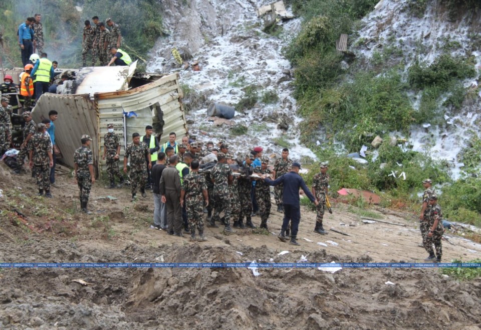 Soldiers were seen carrying people away on stretchers