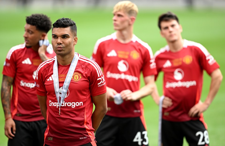 a group of soccer players wearing snapdragon jerseys stand on a field