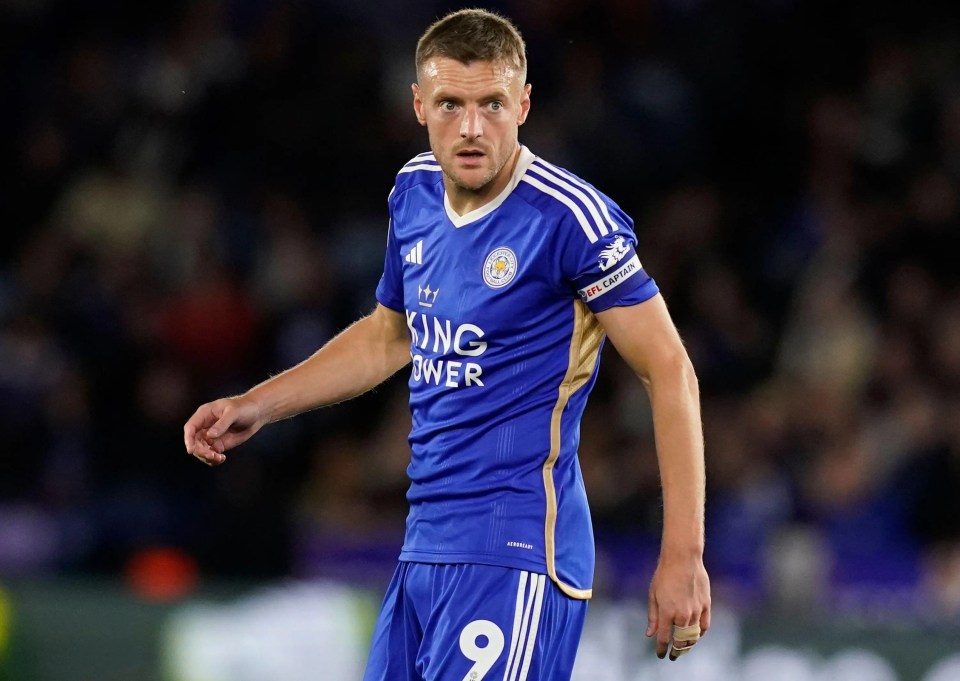 a soccer player wearing a blue jersey with the number 9 on it