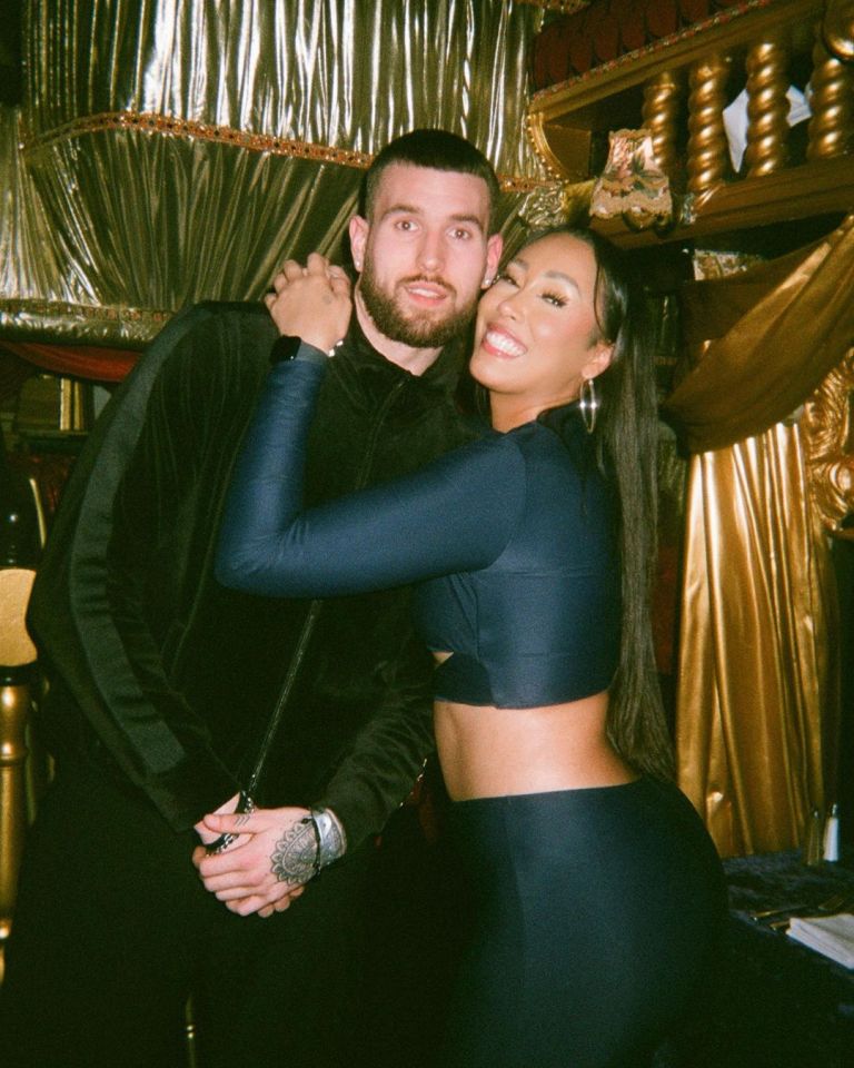 a man and a woman are posing for a picture together