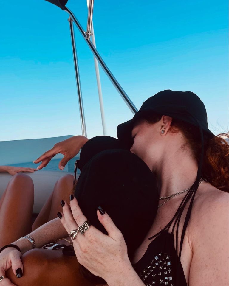 a woman wearing a ring that says ' 88 ' on it