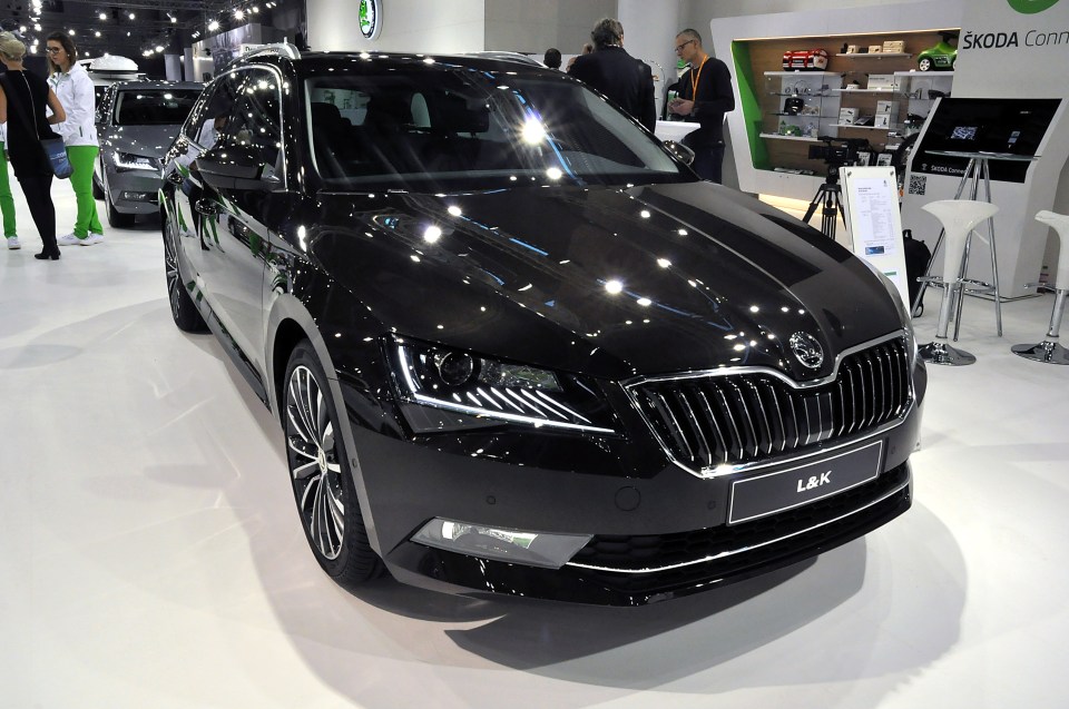a black skoda car is on display at a car show