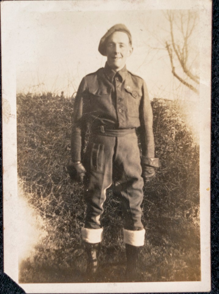 a black and white photo of a man in a military uniform