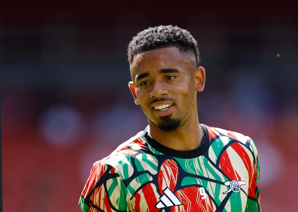 a man wearing a colorful shirt with the number 9 on it