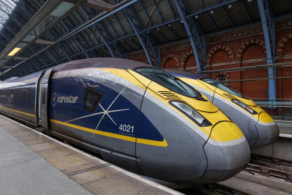 two eurostar trains are parked next to each other