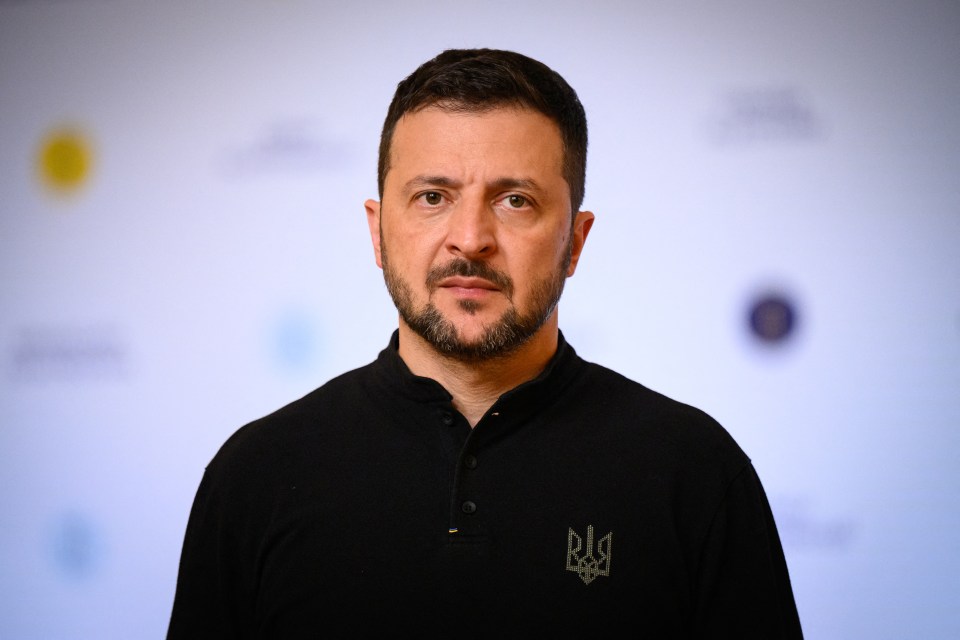 a man with a beard wears a black shirt with the letters rl on it