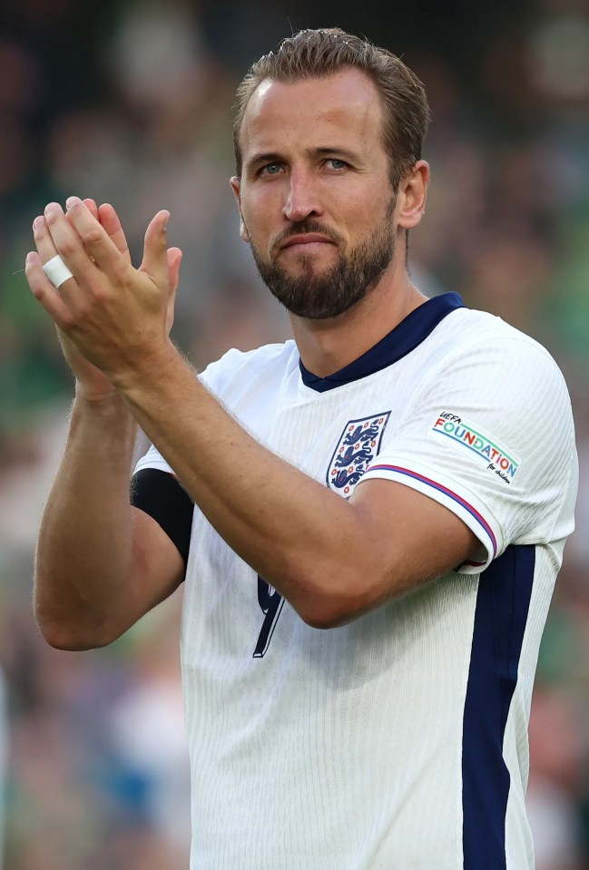 a man wearing a white shirt with the number 1 on it