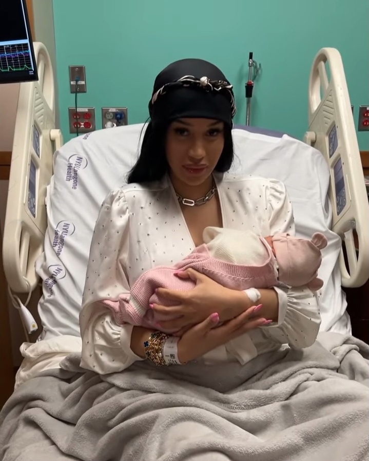 a woman is holding a baby in a hospital bed that says my daughters hospital