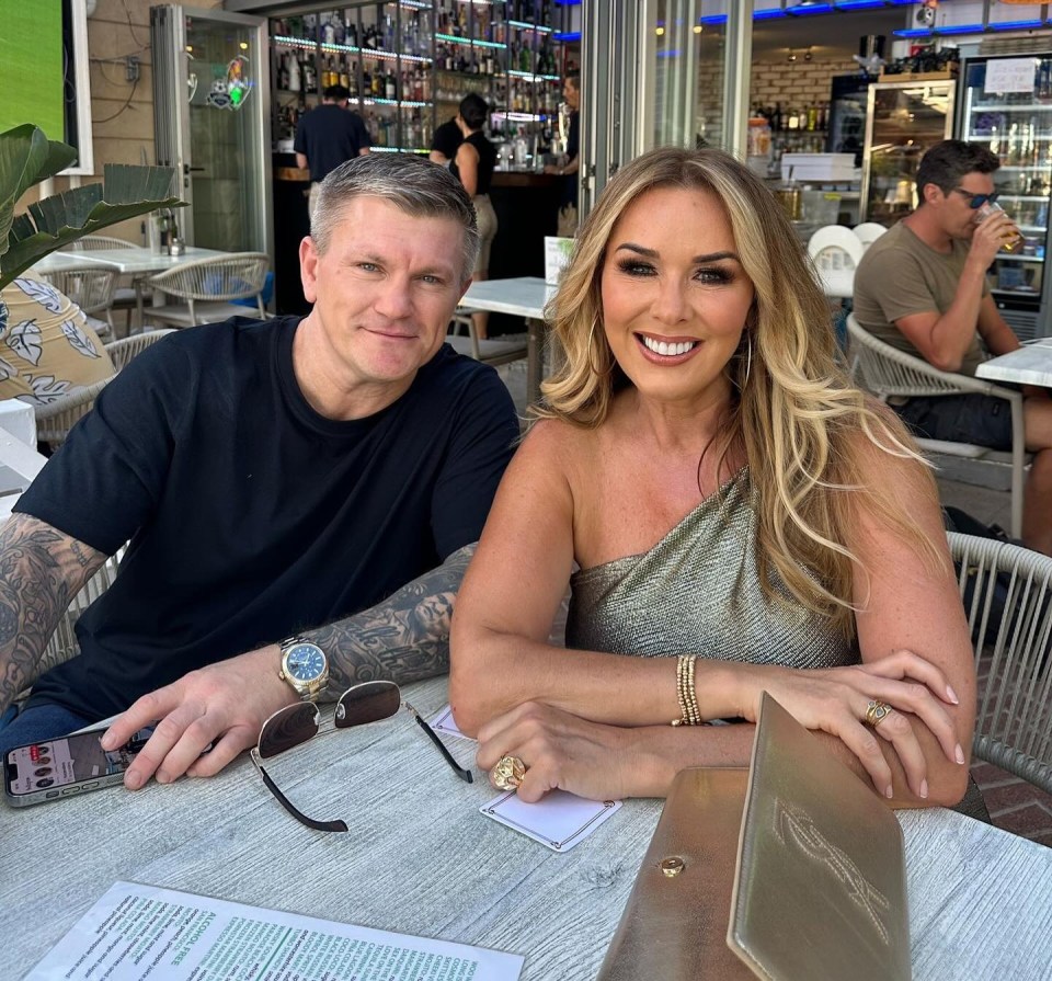 a man and a woman sit at a table in a restaurant