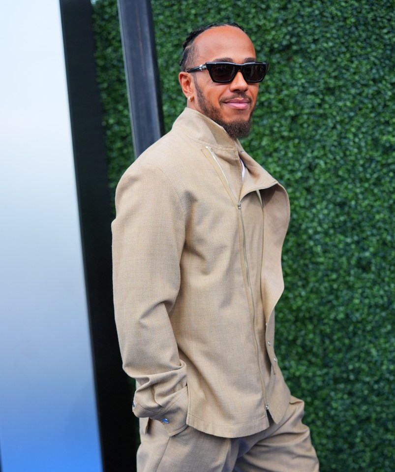 a man wearing sunglasses and a tan jacket