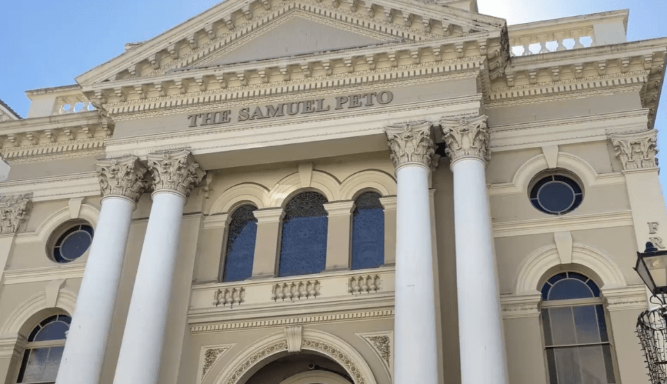 the samuel peto building with columns and arched windows