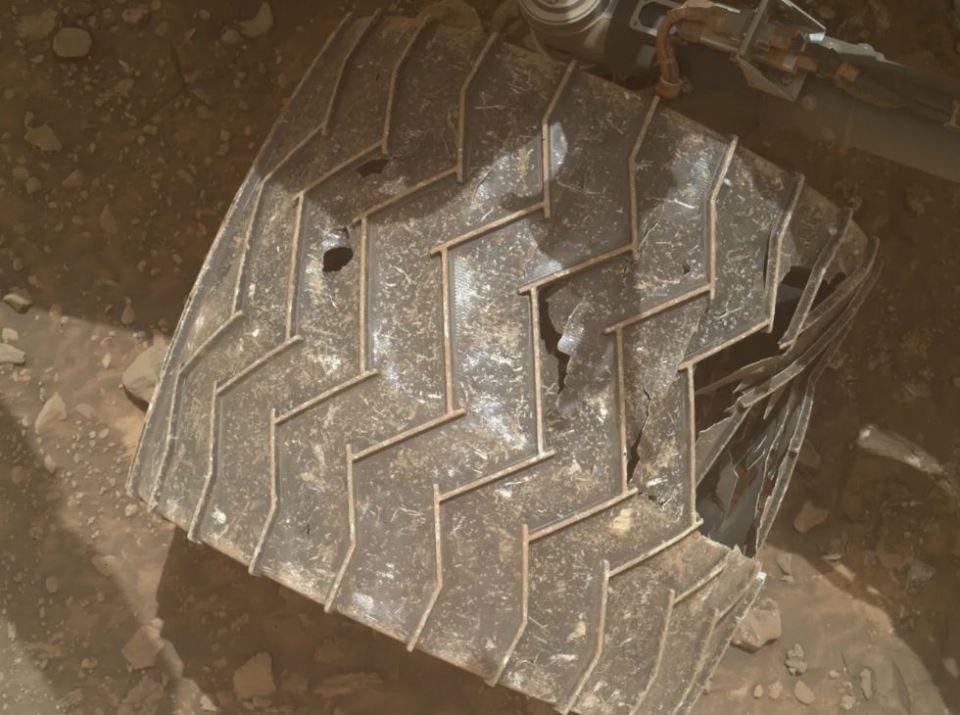 a close up of a tire with a hole in it