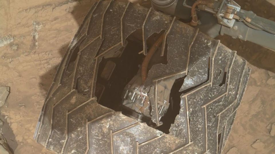 a close up of a tire with a hole in it