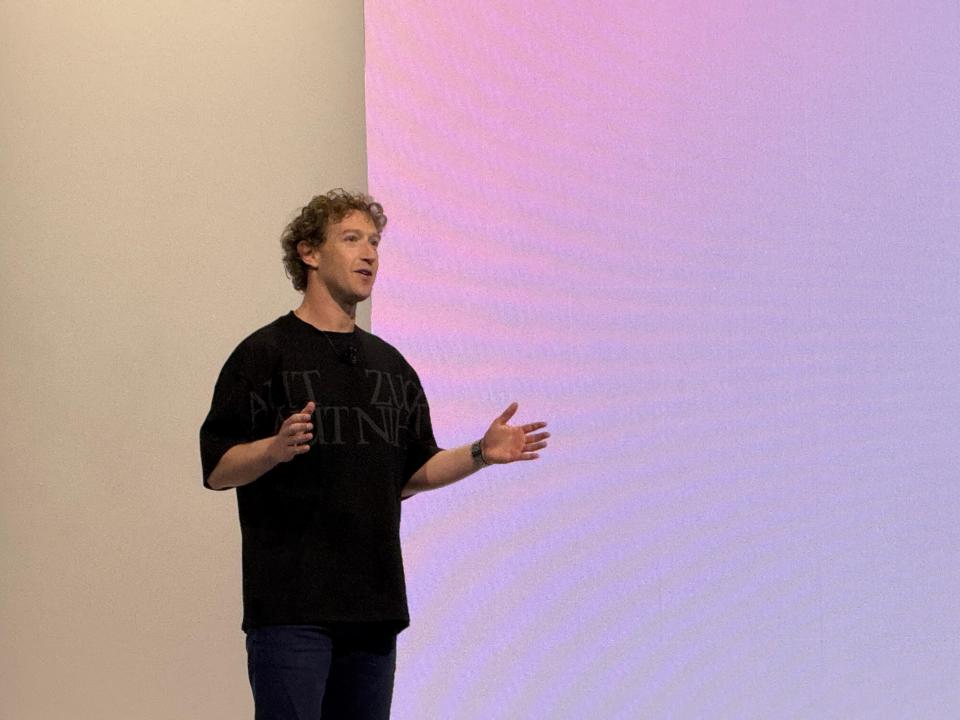 a man wearing a black shirt that says " nt " on it