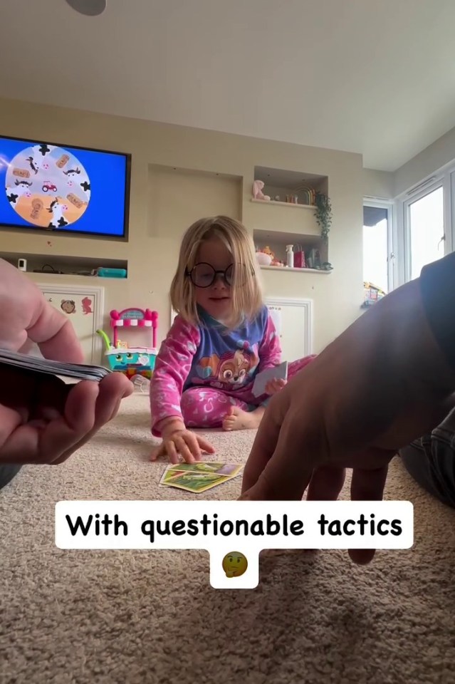 a little girl is playing a game with questionable tactics