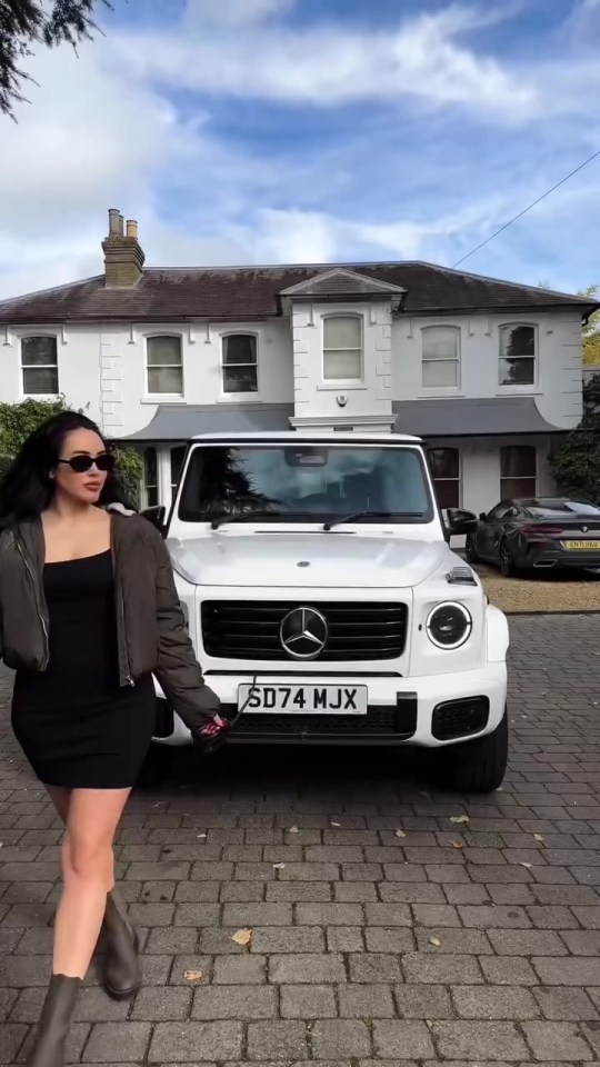 a white mercedes with a license plate that says sd74 mjx