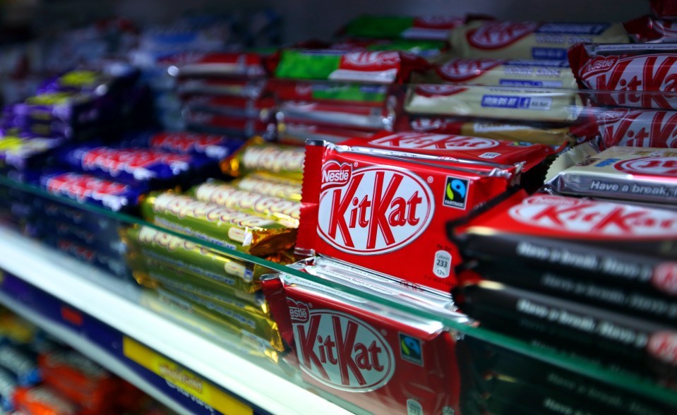 a display of kitkat candy bars on a shelf