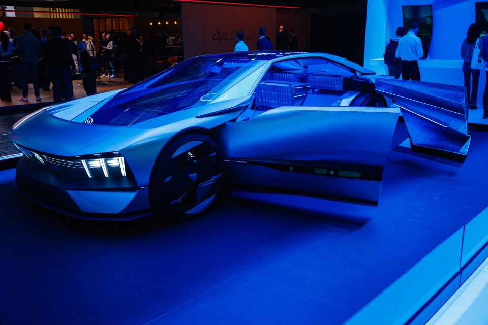 a futuristic car is on display with its doors open
