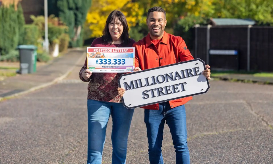a man and woman holding a sign that says millionaire street