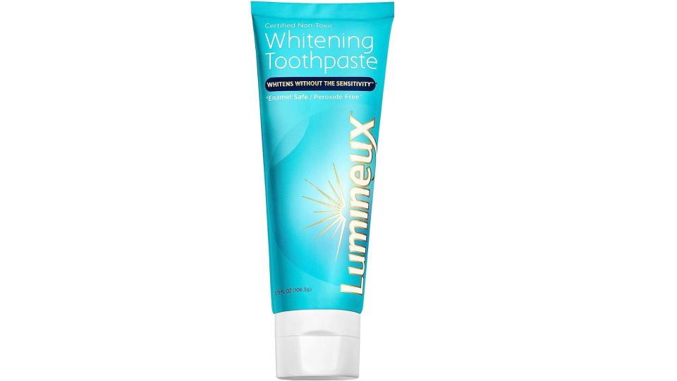 a tube of lumineux whitening toothpaste on a white background