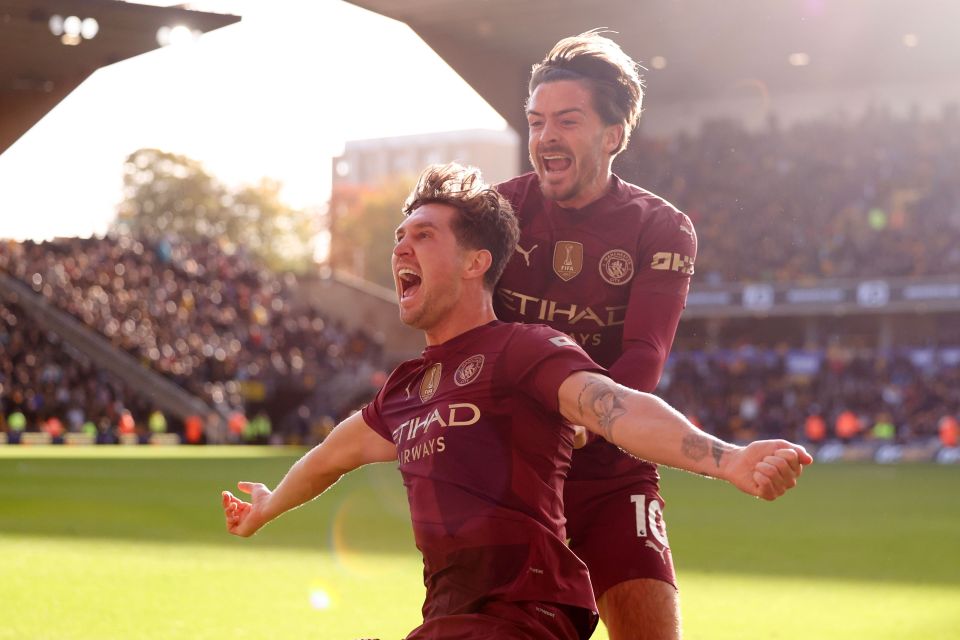 two soccer players wearing shirts that say etihad airways