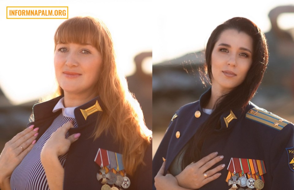 two women in military uniforms are standing next to each other