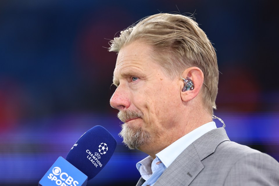 a man speaking into a cbs sports microphone
