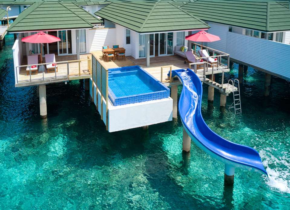 a house with a pool and a slide in the water