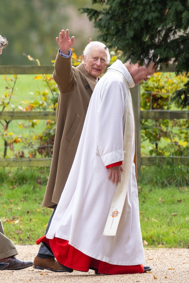 a man in a white robe with a cross on it