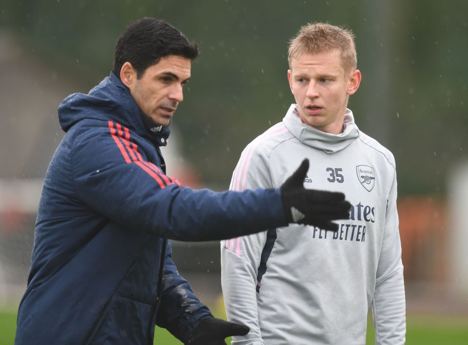 a man with the number 35 on his shirt talks to another man