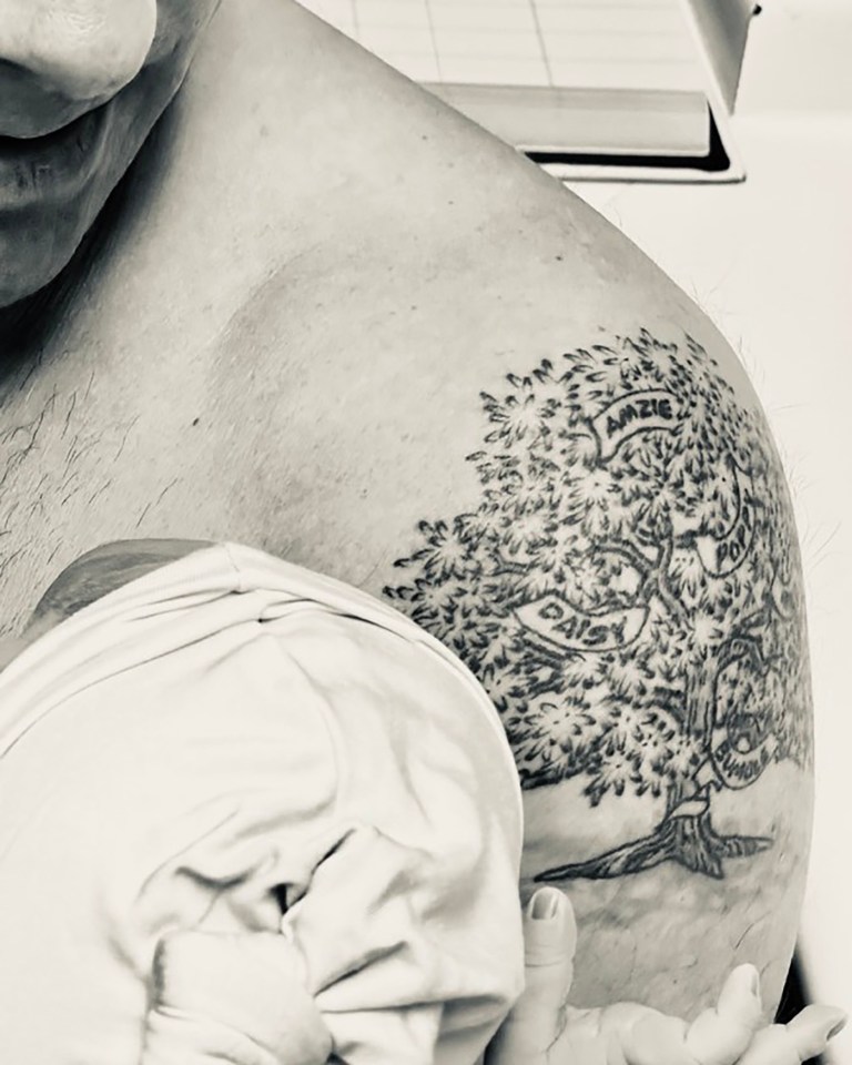 a man has a tattoo of a tree on his shoulder that says grazie