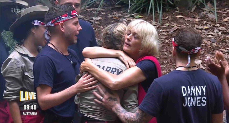 danny jones is hugging a group of people