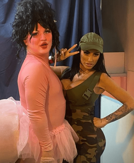 a woman in a army hat stands next to a man in a pink tutu