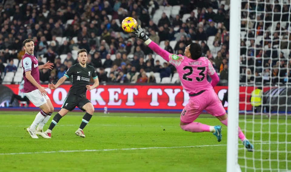 Diogo Jota scores a goal for Liverpool.