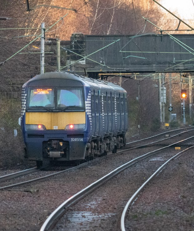 Train traveling on railway tracks.