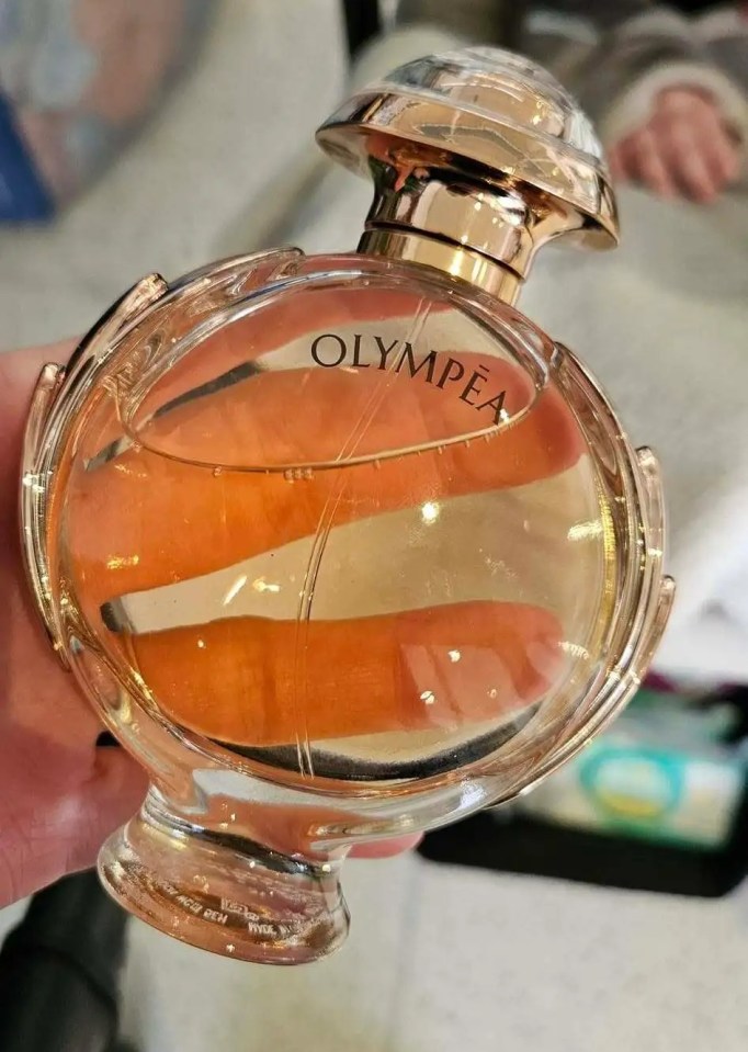 Bottle of Olympéa perfume.