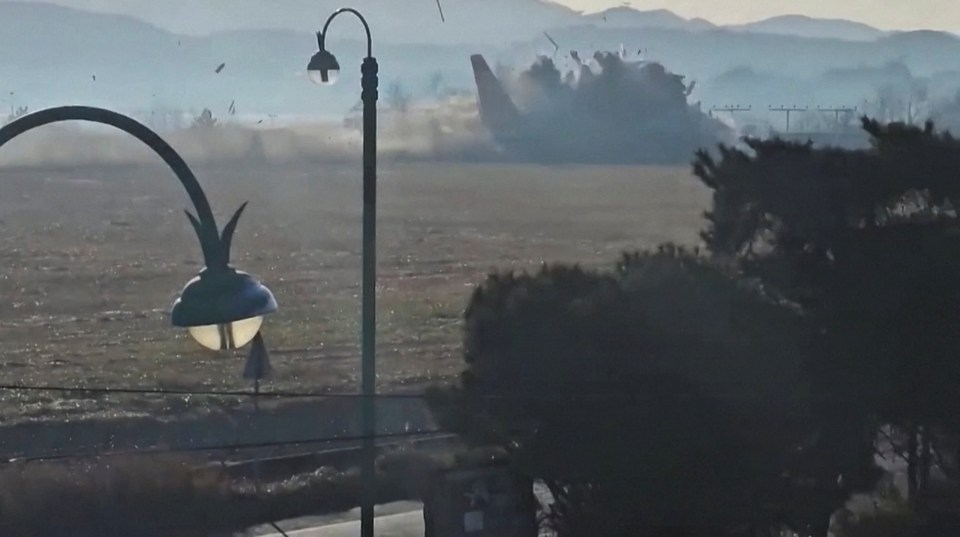 Plane crashing into a wall at Muan International Airport.