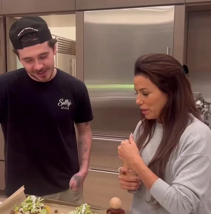 Eva Longoria and Brooklyn Beckham cooking together.