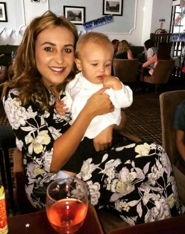 Woman holding a baby.