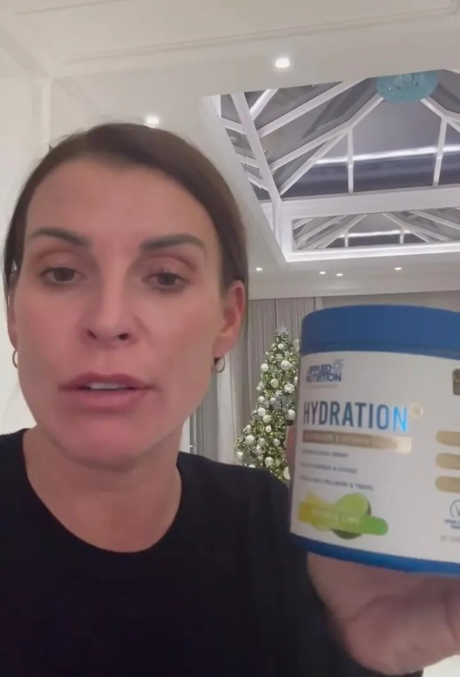 Coleen Rooney shows a jar of hydration powder.