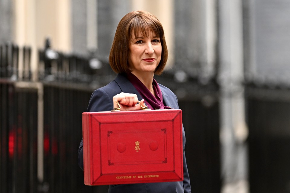 Rachel Reeves, Chancellor of the Exchequer, carrying the red Budget Box.