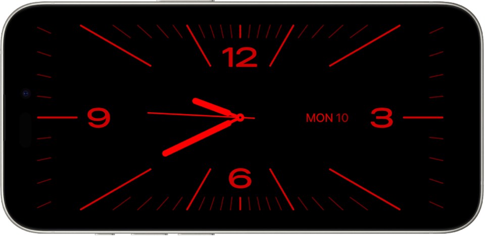 iPhone lock screen showing a red clock on a black background.