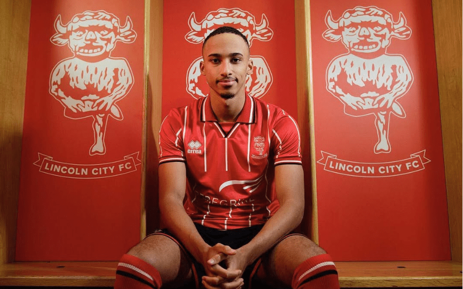Lincoln City FC player in new kit.